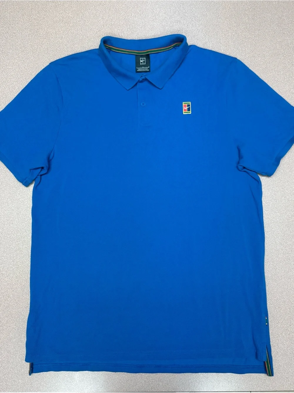 Nike Court Heritage Tennis Blue Polo Shirt with Small Multicolor Crest L